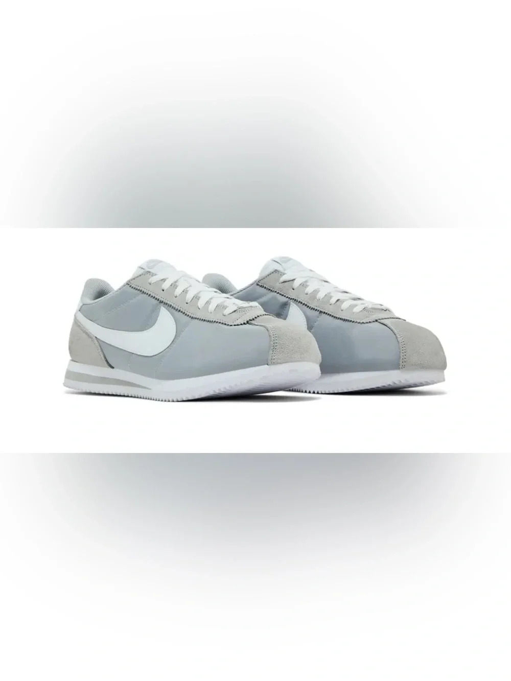 Woman’s gray Nike Cortez basic nylon